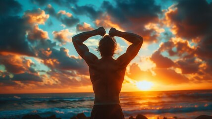 Fototapeta na wymiar Strong man with muscled arms up, Silhouette of fit male athlete, from behind, standing at ocean, on the beach, raising arms, in happiness