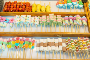 Colorful Candy Skewers at a Market Stall