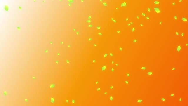Fresh green leaves falling and flowing on the wind in the right half side of sunset color orange gradient background. Abstract background with a scene of early summer time.