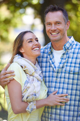 Fototapeta premium Park, summer and portrait of couple with love in countryside for bonding, marriage and anniversary in nature. Forest, man and woman with happiness for commitment on holiday, vacation and date