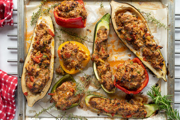 Stuffed vegetables with healthy, turkish minced meat filling on a baking tray