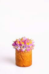 Freshly baked bread with tulips on white background.