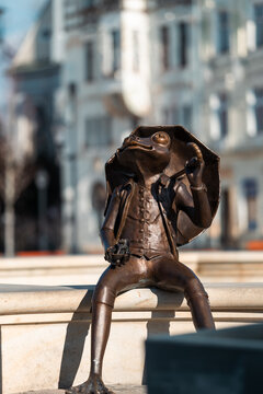 Bielsko-Biala, Poland - January 18, 2024: Bronze sculpture of a frog located on the Polish Army Square (Plac Wojska Polskiego). A nice and funny urban decoration reffering to the city's architecture.