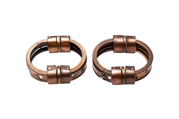 Pair of Metal Rings. Two metal rings are placed side by side. The rings are circular in shape and made of shiny metal, highlighting their smooth texture. The image depicts simplicity and minimalism.