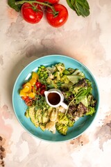 Top view of a Balanced Diet Plate With Vegetables, Salad And Dressing. Salad Bowl.