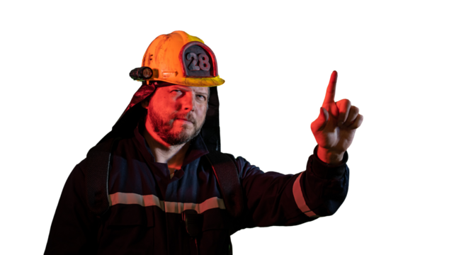 the male firefighter shows a hand gesture attention carefully