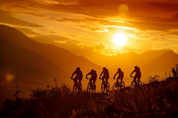 Bicyclists riding on a hill during sunset