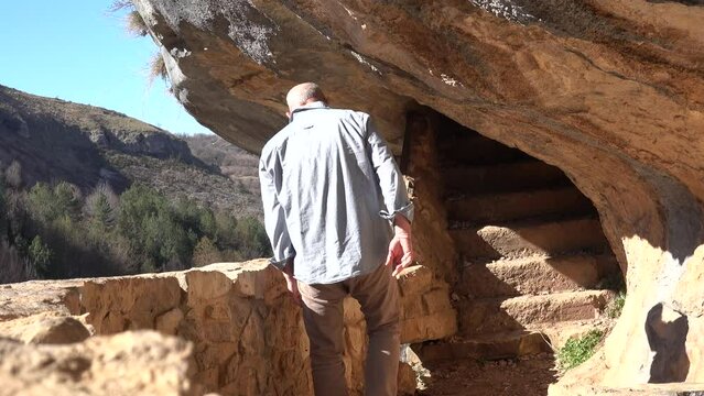 Roccamorice, Italy A man walks into the Hermitage of San Bartolomeo, an ancient abbey carved into the rock. 