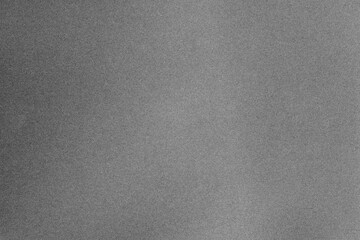 Dark grey paper texture with grain macro closeup