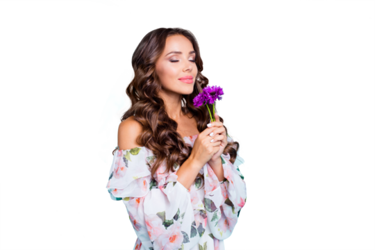 Profile side view photo of lovely, brunette young woman hold small bouquet of summer flowers in hand and breathe in their smell isolated on shine teal background stand half a turn