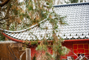 Granby, Quebec - Dec 31 2023: Beautiful chinese style pavillon snow covered in the winter Granby...