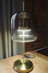 An interesting designer lamp on a golden base with thick glass. English style. Classic interior - 743938384