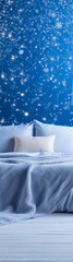 Obraz premium Blue and white bedroom with snowflakes falling.