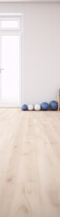Fototapeta na wymiar Bright and airy room with a wooden floor and white walls, furnished with blue and white exercise balls
