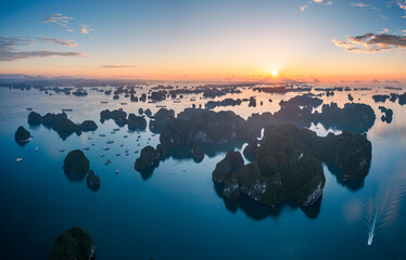 Aerial view of Ha Long Bay during sunrise and beautiful day, blue clear sky. Vietnam tourist...