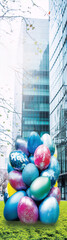 Fototapeta na wymiar Surreal photo of a pile of Easter eggs in front of a skyscraper