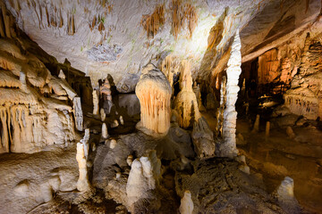 Postojna, Slovenia - June 27, 2023: Exploring beautiful Postojna cave in Slovenia the most visited european cave. Thousands of stalagmites and stalactites