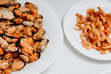 Delicious shrimp and mussels. Seafood on a white plate