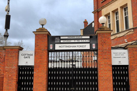Gates of Craven Cottage football stadium in West London, home of Fulham F.C., advertising match vs. Nottingham Forest