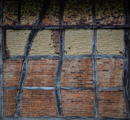 old timber framing  brick wall.