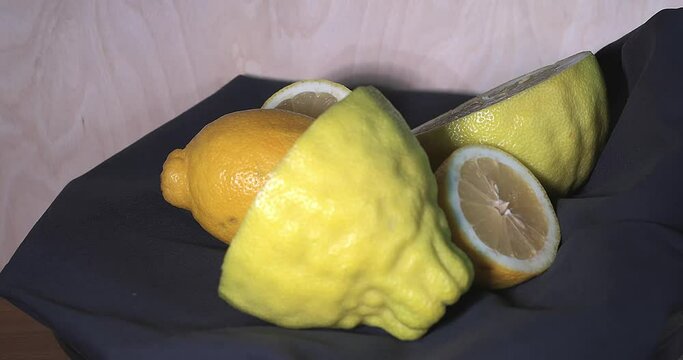 A fresh giant yellow lemon on a rotating table. The weight of a lime is 1 kg