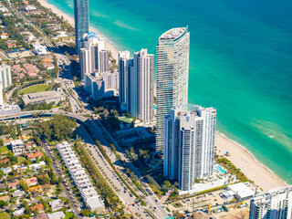 Fototapeta na wymiar High aerial photo highrise condominiums on the beach Sunny Isles Miami 2024