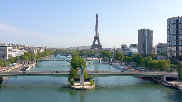 PARIS, FRANCE - MAY 30, 2023: Aerial view of Tour Eiffel Tower and Seine River bridge and historical city center. Famous touristic landmark, world heritage of architectural masterpieces