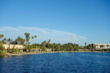 Shore of San Barbara Cove full of resorts and hotels with water front cabanas and recreational areas at Mission Bay, San Diego, California