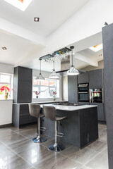 Beautiful grey slate and marble European style modern home kitchen. Elegant minimal home interior style decor. Luxury living standards at home.