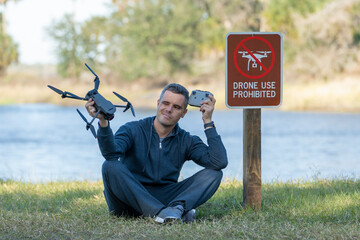 Operator is disappointed because he can not fly his quadcopter in national park no drone area. Man...