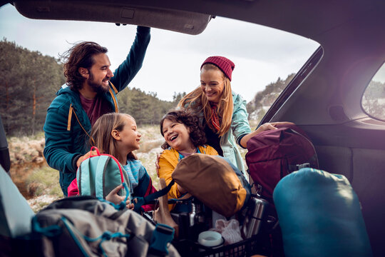 Family packing car for a hiking trip in nature