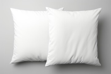 Simple and elegant white pillows on a neutral gray backdrop. Suitable for home decor or interior...