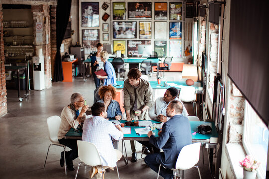 Diverse team meeting and brainstorming in a creative office space