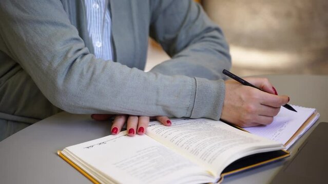 Middle aged woman scientist write thesis in university library Mature student exercising in college Freelancer typing e-mail on keyboard using laptop in coworking upgrading professional qualification