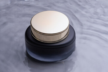 Jar of luxury face cream in a water. Cosmetic mockup. beauty product and skincare, cosmetic science concept