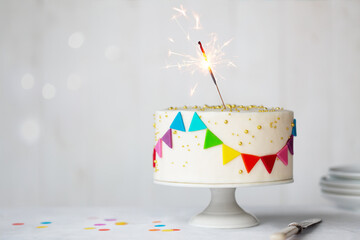 Celebration birthday cake with colorful bunting