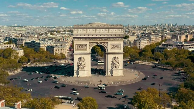 PARIS, FRANCE - MAY 30, 2023: Aerial view over Triumphal Arc traffic in central Paris cityscape. Famous touristic landmark, world heritage of architectural masterpieces.