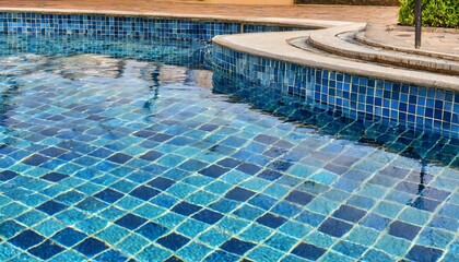blue tiles pool with ripple water reflection