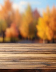 Naklejka na ściany i meble A wooden table, void of any objects, set against a blurred background depicting the vibrant and lively atmosphere of autumn. The exuberant image captures the essence of the season