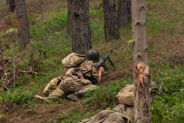Historical reconstruction. An American paratroopers soldier from the World War II  fighting in the...
