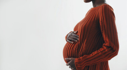 banner pregnant black woman in red clothes holds hands on belly. Pregnancy, maternity, preparation and expectation. Close-up, copy space. side view