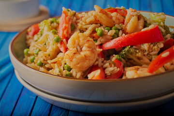 Thai styled prawn stir fry shot close up with chopsticks alongside.