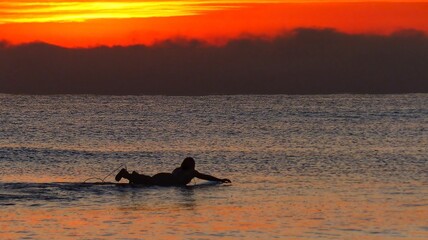 Surfer receiving the sunrise on Cabanyal beach