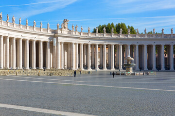 Colonnade on St.Peter's Square in front of Saint Peter's Basilica. Deserted square due to the...