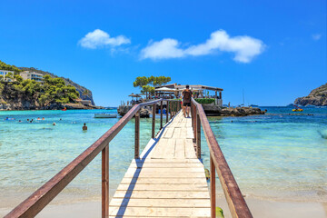Camp de Mar - wooden walkway to a rocky island