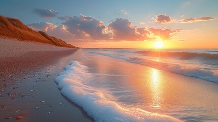  the sun is setting over a beach with waves coming in to shore and sand blowing in the foreground, and a cliff on the far side of the beach. - obrazy, fototapety, plakaty