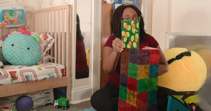 Autistic toddler stimming while mom tries to get him to play