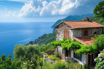 Fototapeta na wymiar A beautiful house with ocean views stands on a cliff, offering a breathtaking vista of the crashing waves below, Italian countryside villas overlooking the sea, AI Generated