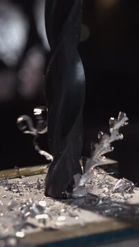 Witness the precision of metal drilling in stunning 4K vertical slow motion.