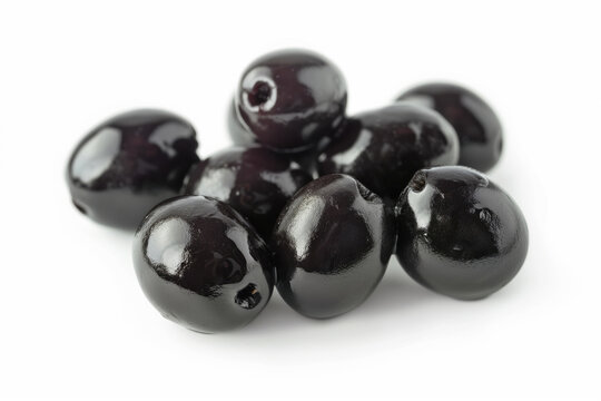 A close-up image showcasing the glossy texture and rich color of black olives, isolated on a white background.